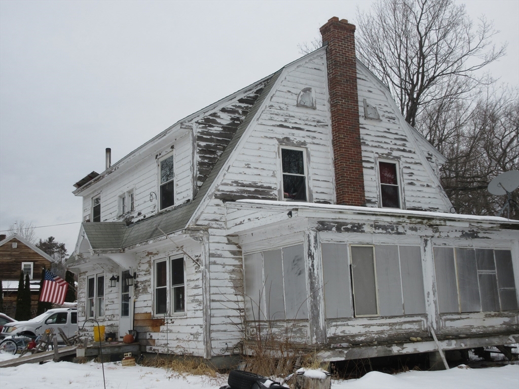 78 Main Street Blandford, MA 01008 - Photo 7 of 8 a front view of a house with a yard