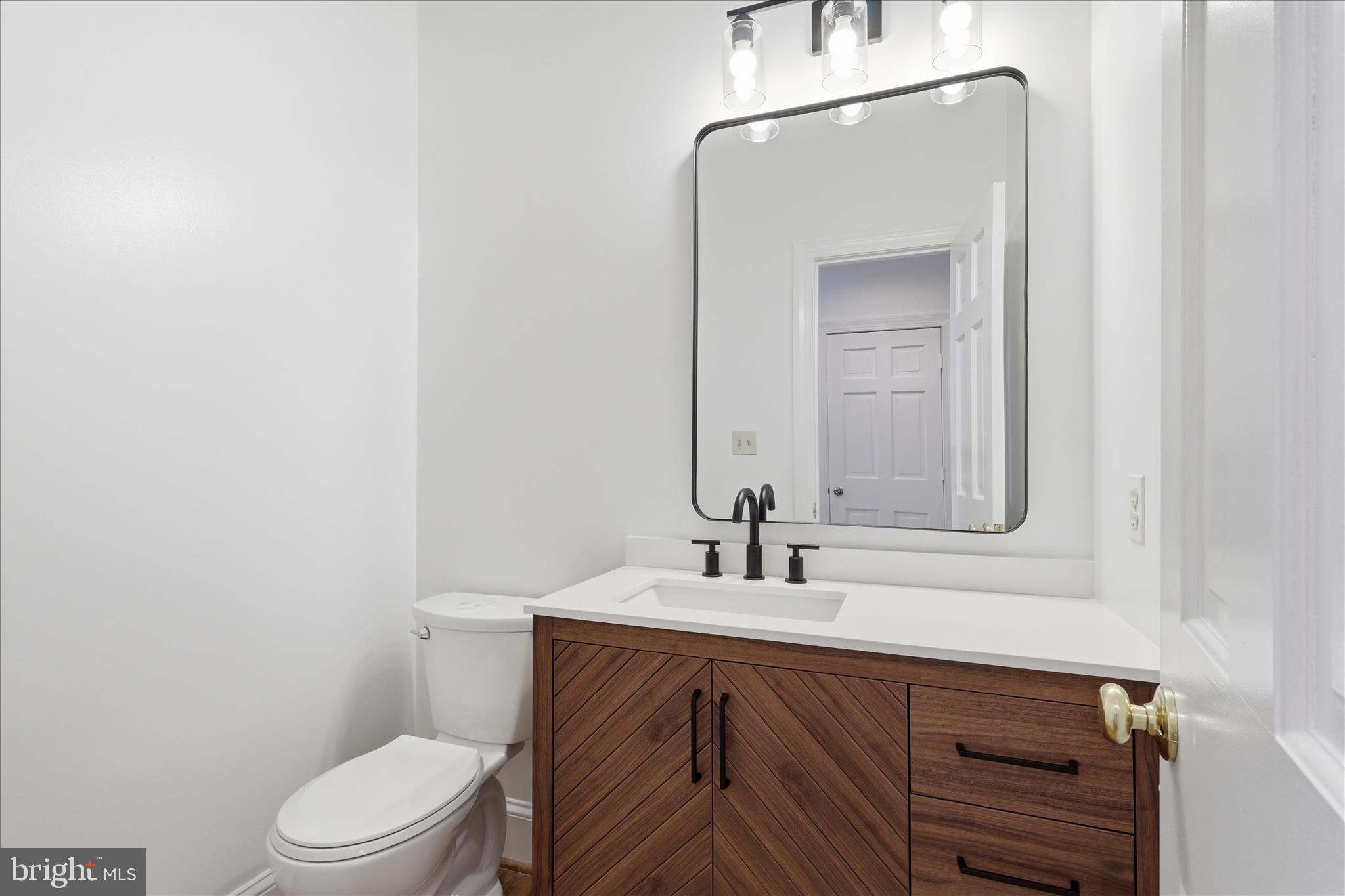 1051 Kelso Road Great Falls, VA 22066 - Photo 13 of 40 Main level bath with new vanity and toilet