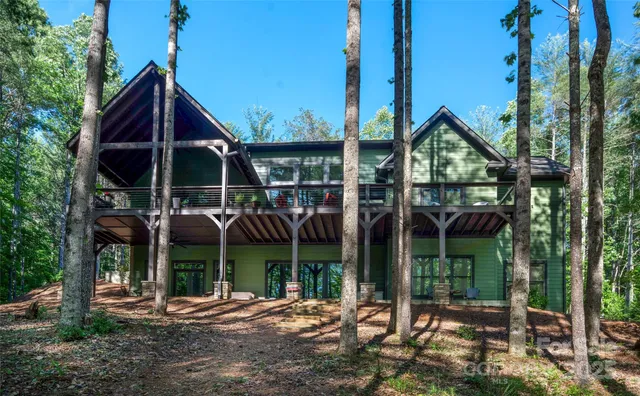 a view of a house with a yard and balcony