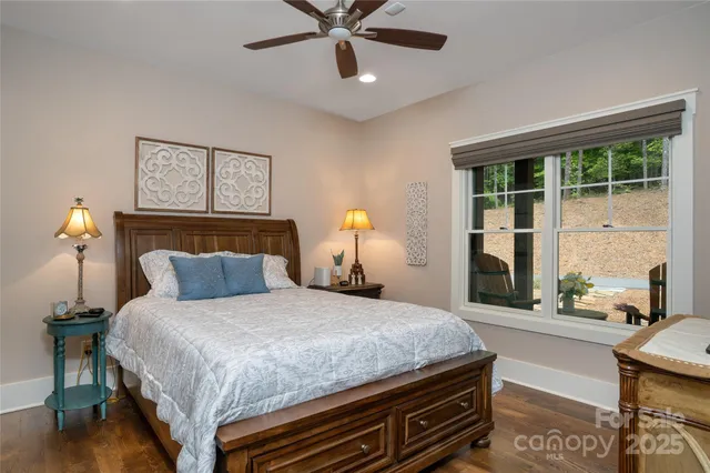 a bedroom with a bed and window