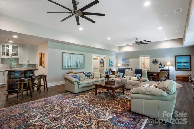 a living room with furniture and a dining table
