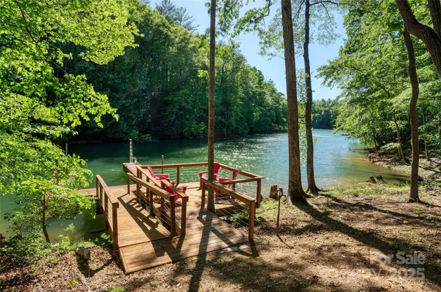 a view of a wooden deck with a backyard