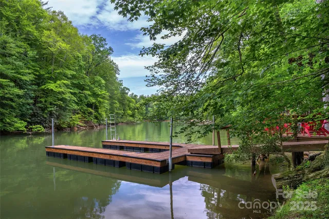 a view of a lake with trees by side of it