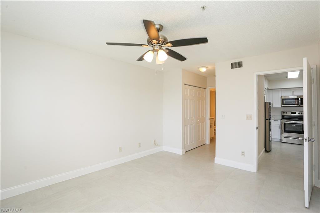 1265 Wildwood Lakes Boulevard, Unit 3306 Naples, FL 34104 - Photo 16 of 39 a view of an empty room