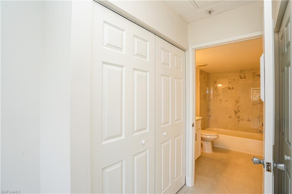 1265 Wildwood Lakes Boulevard, Unit 3306 Naples, FL 34104 - Photo 19 of 39 a bathroom with a shower