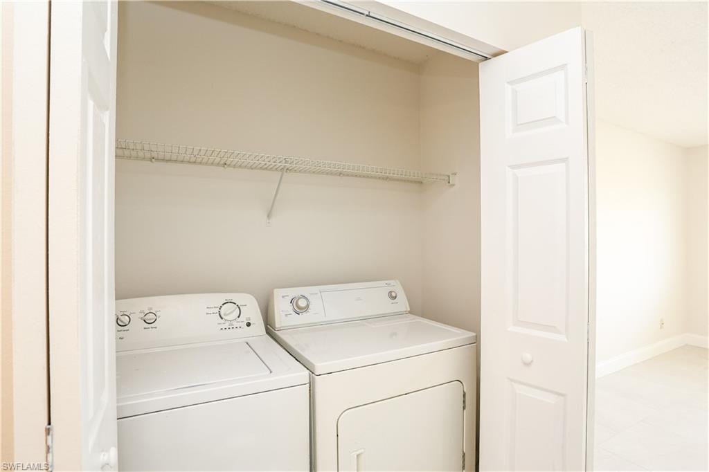 1265 Wildwood Lakes Boulevard, Unit 3306 Naples, FL 34104 - Photo 21 of 39 a utility room with dryer and washer