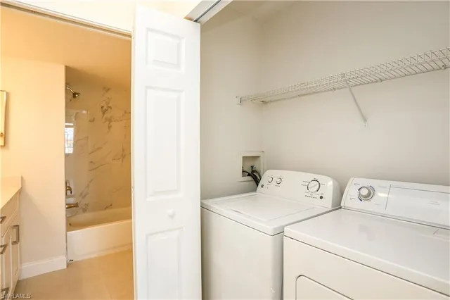 a utility room with dryer and washer