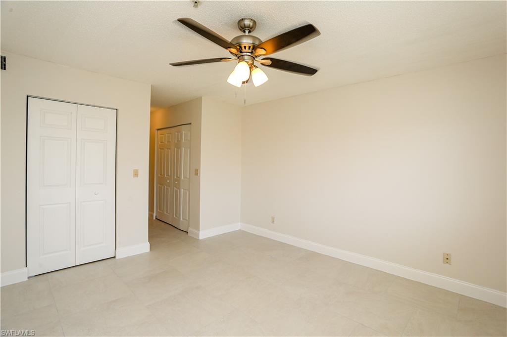 1265 Wildwood Lakes Boulevard, Unit 3306 Naples, FL 34104 - Photo 27 of 39 an empty room