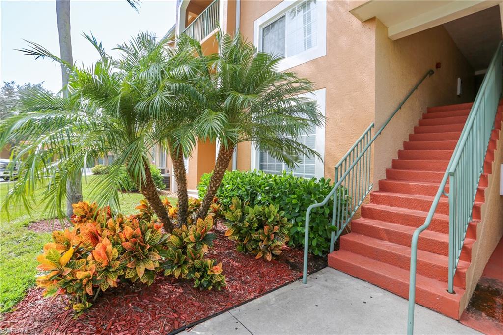 1265 Wildwood Lakes Boulevard, Unit 3306 Naples, FL 34104 - Photo 3 of 39 a view of a backyard with plants