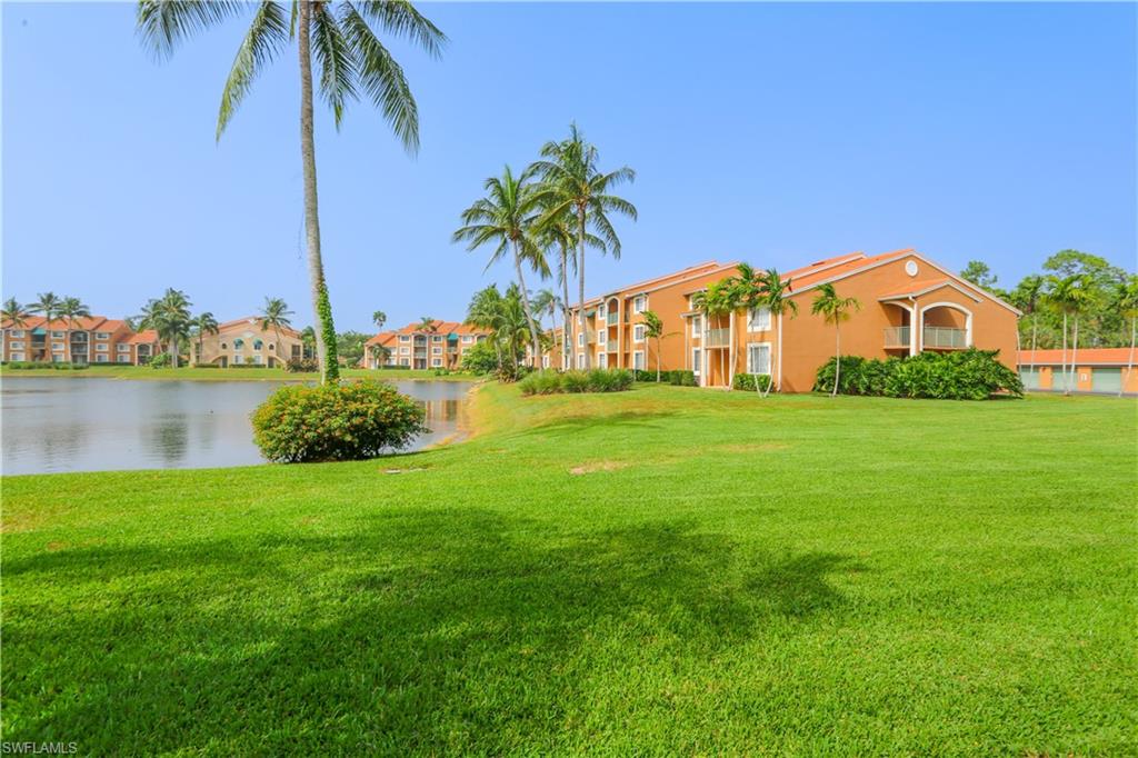 1265 Wildwood Lakes Boulevard, Unit 3306 Naples, FL 34104 - Photo 36 of 39 a view of a garden with a house