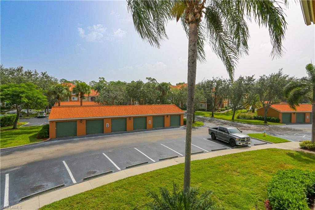 1265 Wildwood Lakes Boulevard, Unit 3306 Naples, FL 34104 - Photo 37 of 39 a view of an house with backyard and swimming pool