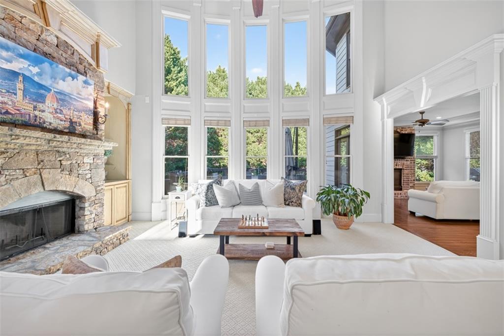 909 Pathview Court Dacula, GA 30019 - Photo 33 of 113 a living room with furniture and a fireplace