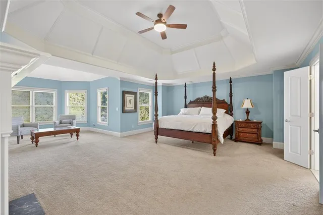 an outdoor space with patio and white umbrellas