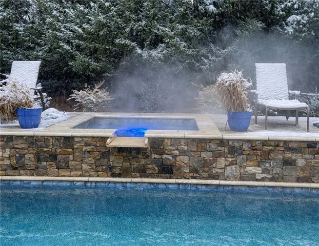 a large kitchen with kitchen island a sink stove and refrigerator