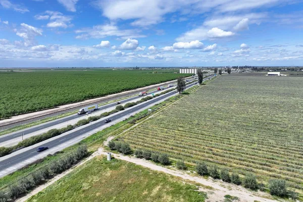 a view of a garden with an ocean view