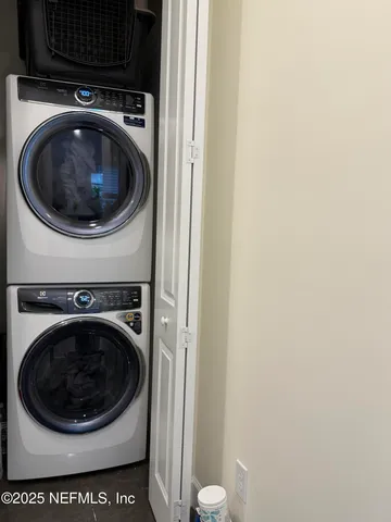 a living room with furniture a rug and a window