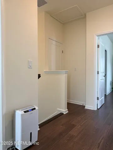 a bathroom with a sink vanity and mirror