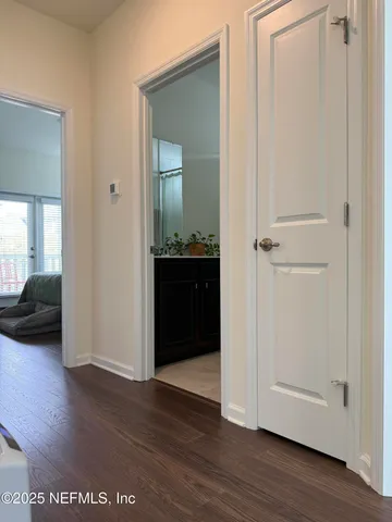 a bedroom with a bed and a mirror