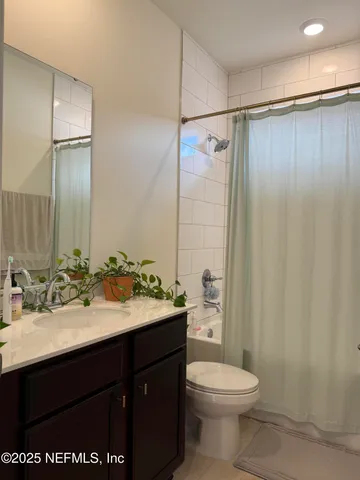 a potted plant sitting in front of a house