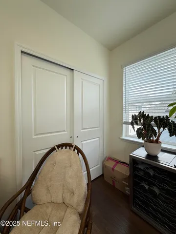 a backyard of a house with yard fountain and outdoor seating