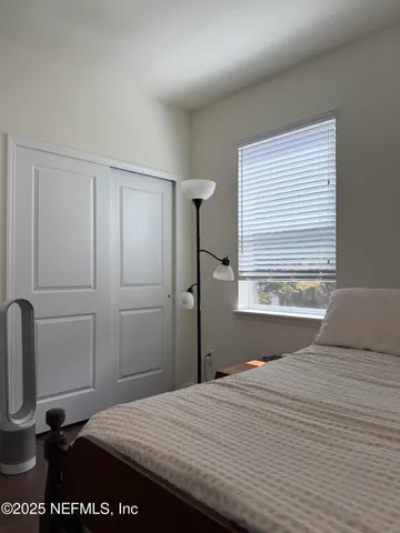 a view of a chairs and table in a balcony
