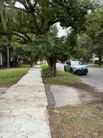 a view of street with parked cars