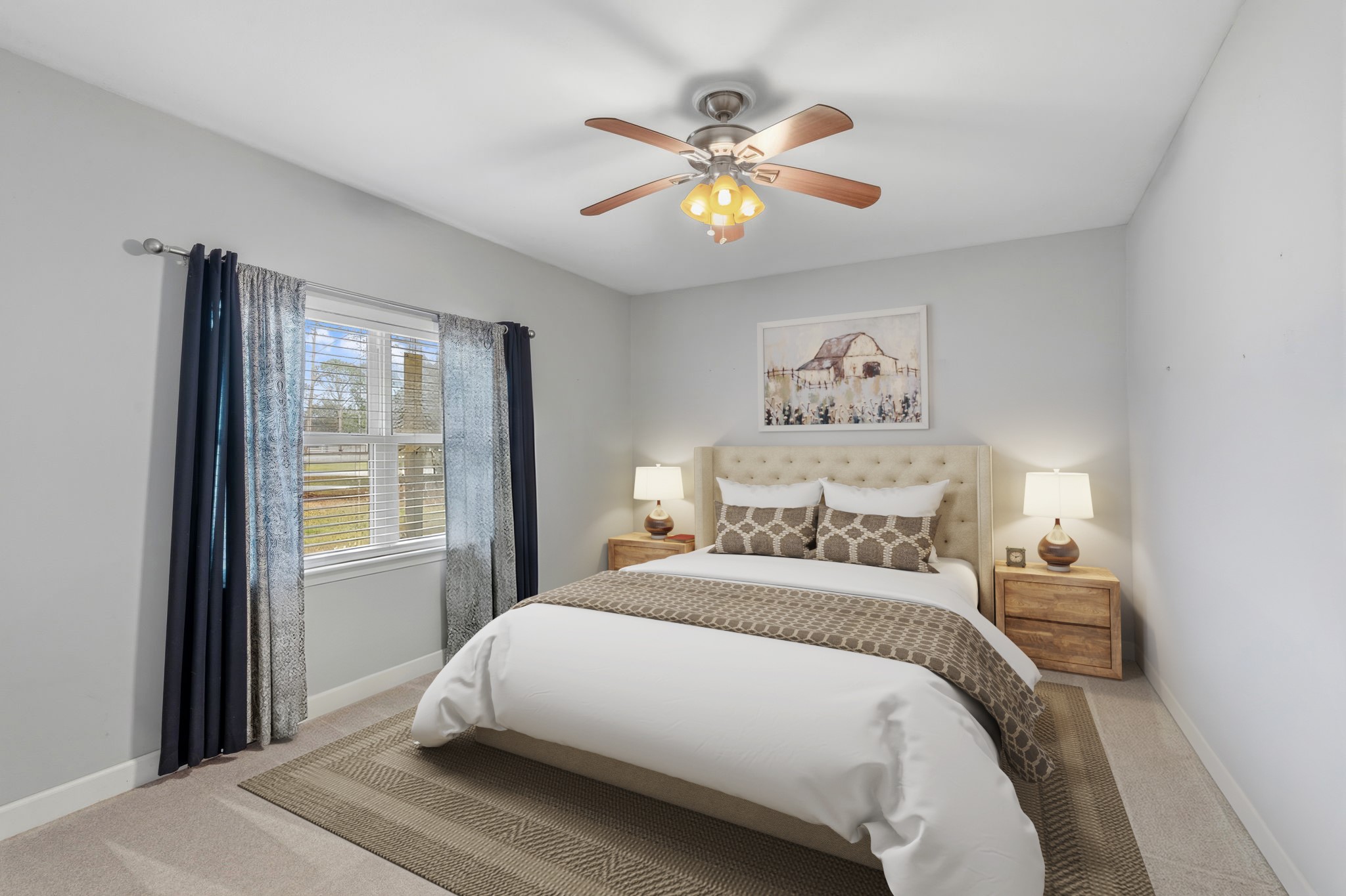 2935 West Fm 1462 Rosharon, TX 77583 - Photo 26 of 50 Virtually Staged: This comfortable secondary bedroom offers a warm, understated retreat well-suited to ranch living. Soft neutral walls and natural light create a calm, welcoming atmosphere, while the ceiling fan adds everyday comfort.