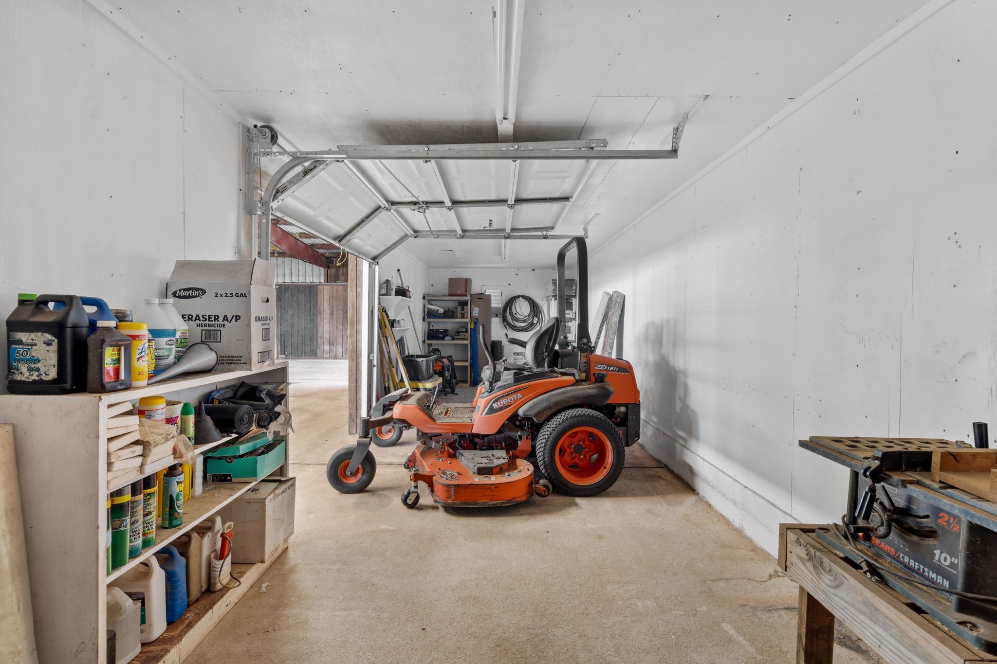 2935 West Fm 1462 Rosharon, TX 77583 - Photo 31 of 50 This spacious, functional garage/workshop is built to support the day-to-day demands of ranch life. With ample room for equipment, tools, and utility vehicles, the space easily accommodates tractors, mowers, and maintenance gear while still leaving room to move and work.