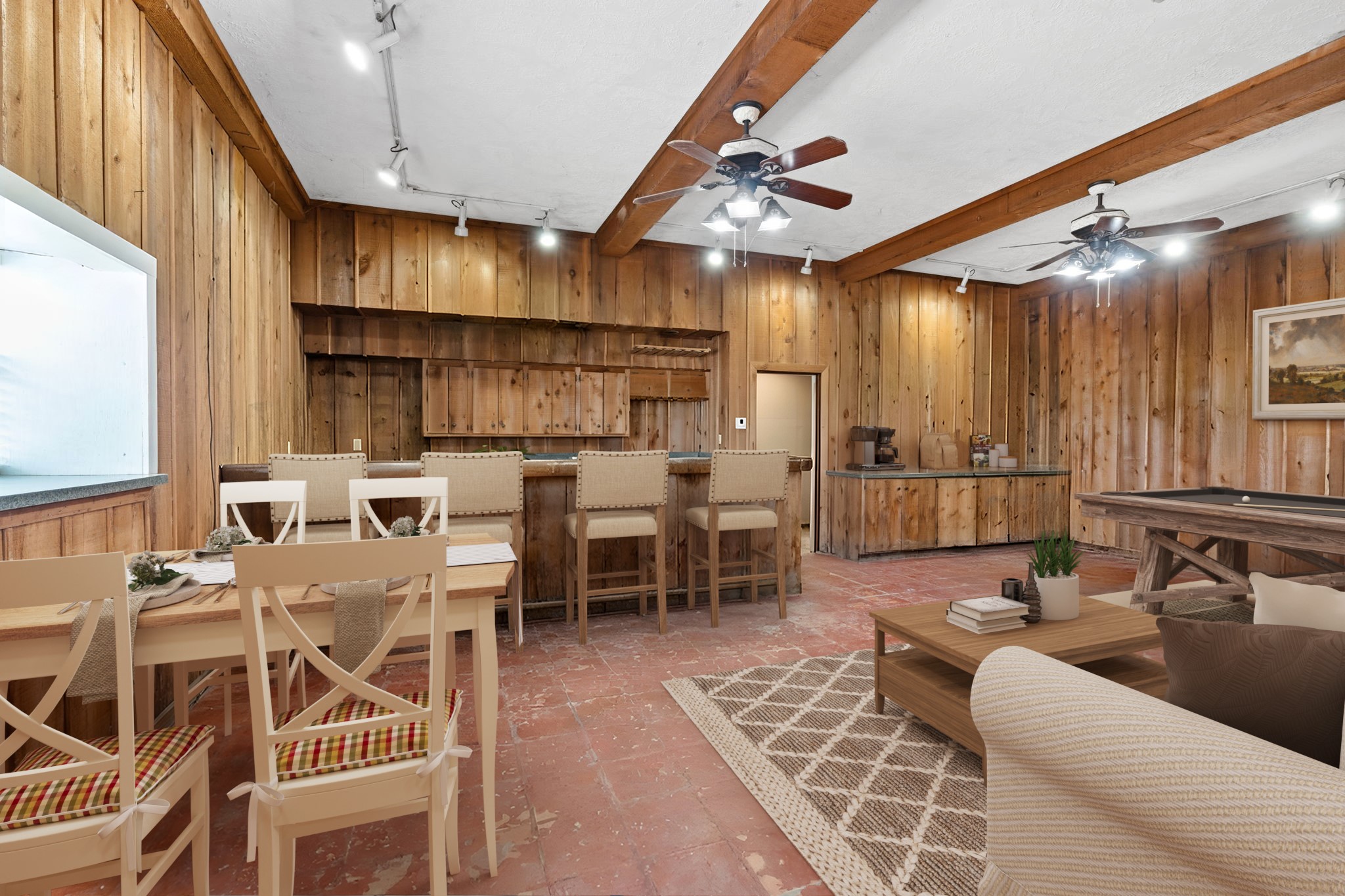 2935 West Fm 1462 Rosharon, TX 77583 - Photo 34 of 50 Virtually Staged: This inviting ranch-style living space blends rustic character with functional comfort, perfect for relaxed gatherings and entertaining. Warm, natural wood paneling and exposed ceiling beams create an authentic ranchhouse feel, complemented by track lighting and ceiling fans that add both charm and practicality. A built-in bar anchors the room, offering ample seating and a natural gathering point, while the adjoining dining area provides space for casual meals or game nights.