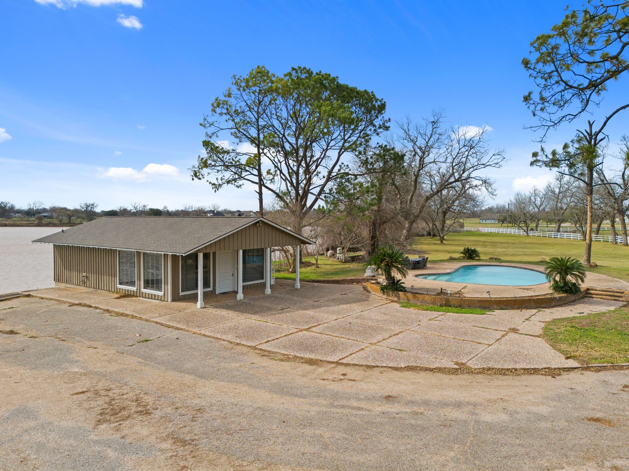 2935 West Fm 1462 Rosharon, TX 77583 - Photo 39 of 50 Framed by mature trees and wide-open skies, the views stretch out across the landscape, creating a breathtaking backdrop that feels both serene and endless. It’s a setting designed to slow you down, soak in the scenery, and enjoy the beauty of the land from every angle.