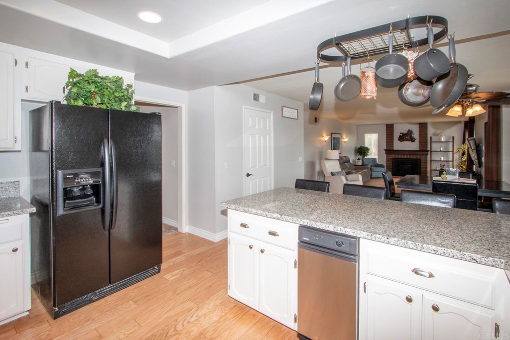 14866 Oakline Road Poway, CA 92064 - Photo 14 of 49 a kitchen with stainless steel appliances granite countertop a refrigerator a oven and a sink