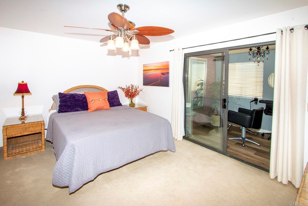 14866 Oakline Road Poway, CA 92064 - Photo 19 of 49 a bedroom with a bed and ceiling fan