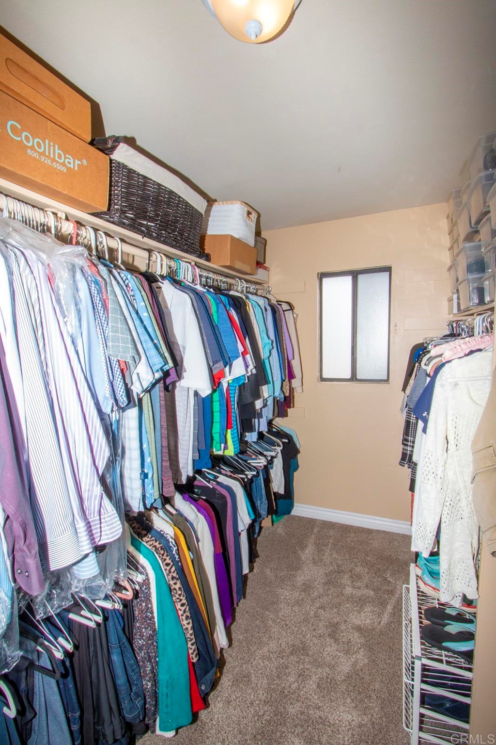 14866 Oakline Road Poway, CA 92064 - Photo 26 of 49 a view of walk in closet with clothes and shoes