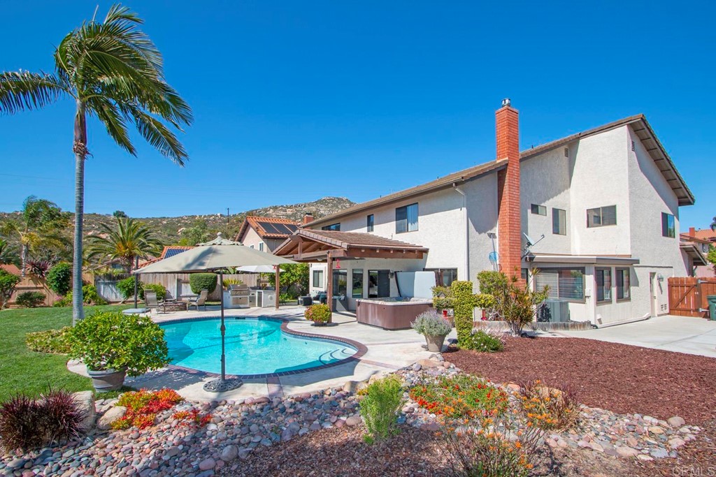 14866 Oakline Road Poway, CA 92064 - Photo 35 of 49 a front view of a house with garden