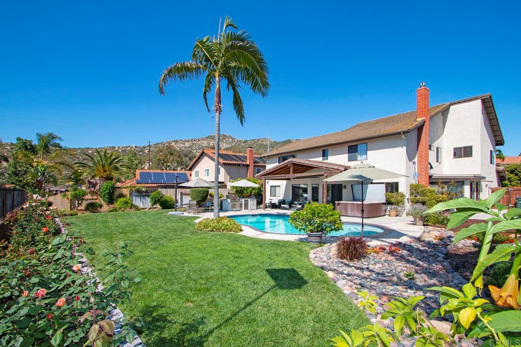 14866 Oakline Road Poway, CA 92064 - Photo 38 of 49 a front view of a house with a garden