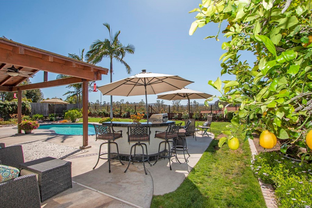 14866 Oakline Road Poway, CA 92064 - Photo 44 of 49 a view of a backyard with sitting area and furniture