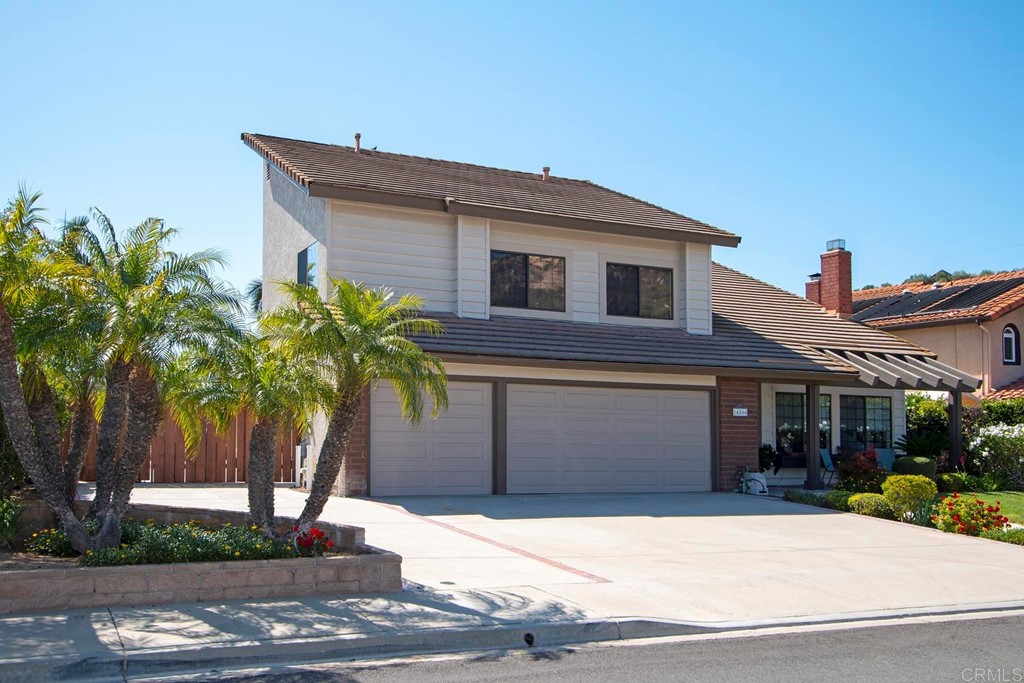 14866 Oakline Road Poway, CA 92064 - Photo 47 of 49 a front view of a house with a yard and garage
