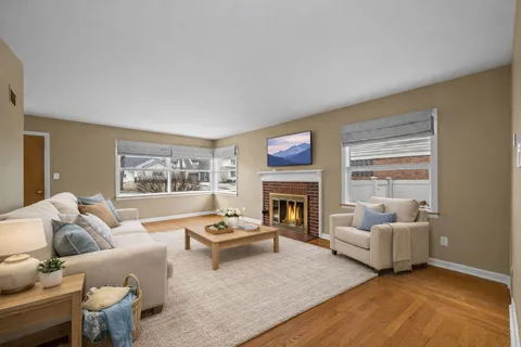 a living room with furniture and a fireplace