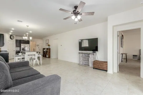 a kitchen with refrigerator and furniture