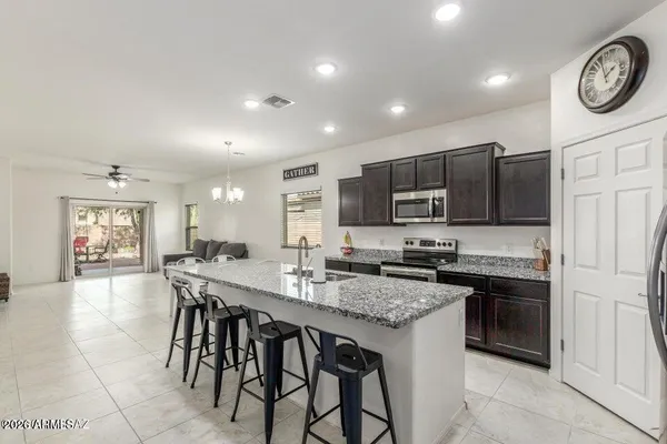 a living room with granite countertop furniture and a table