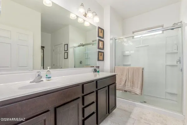 a view of walk in closet with clothes