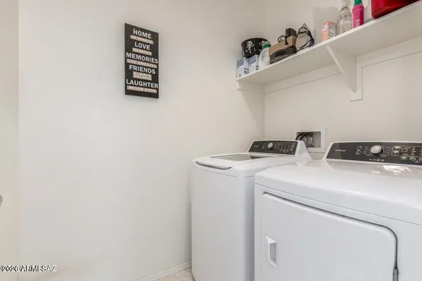 a view of a chair and table in backyard