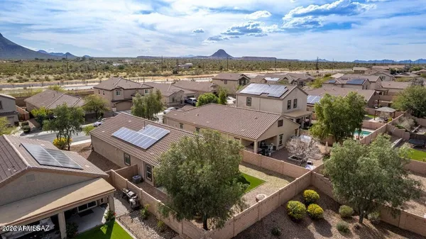 an aerial view of residential houses with outdoor space