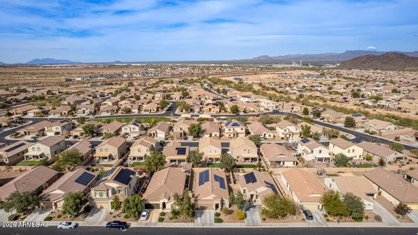 an aerial view of residential building and ocean view