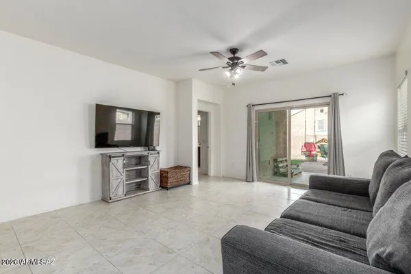 a living room with furniture and a window