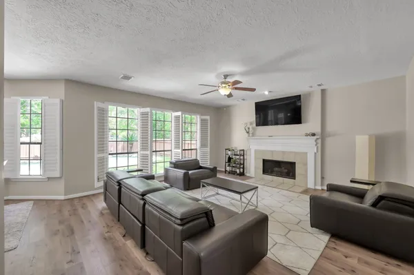 a living room with furniture and a fireplace