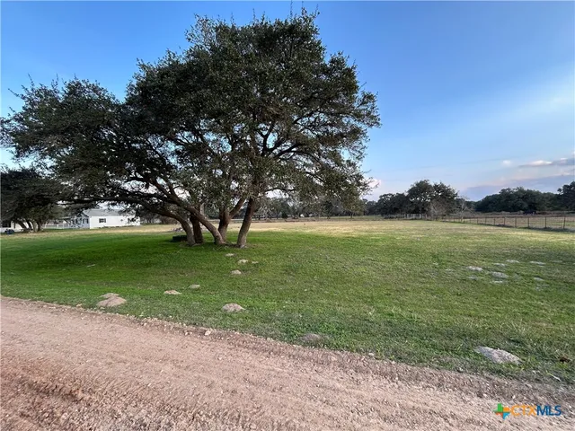 a view of a golf course with a lake