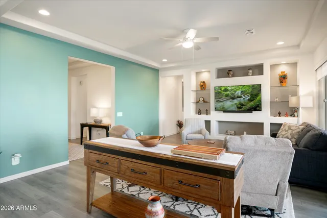 a living room with furniture and a large window