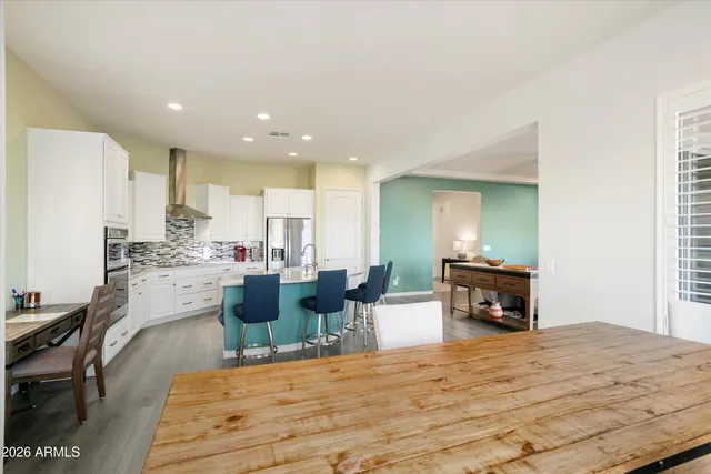 a dining room with furniture and window
