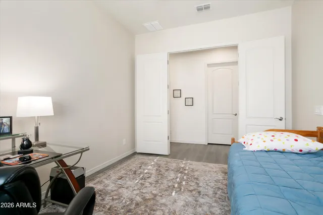 a bedroom with furniture and a window